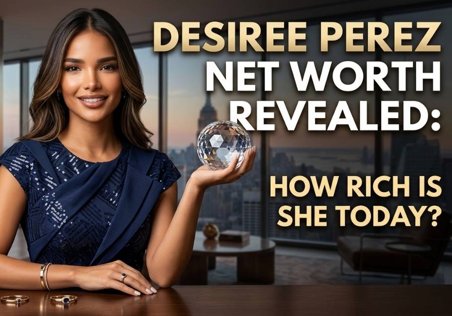 A professional featured image for a celebrity biography article, depicting a smiling woman in a luxury navy blue dress holding a crystal orb in a modern high-rise office overlooking the New York City skyline. Bold, gold and white typography reads: "Desiree Perez Net Worth Revealed: How Rich Is She Today?